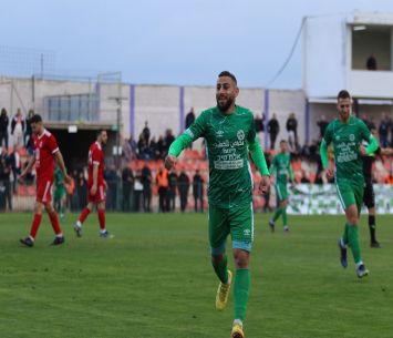 חיוך של ניצחון. עלי דח'לה חוגג כיבוש שער (דאפר מאחמיד)